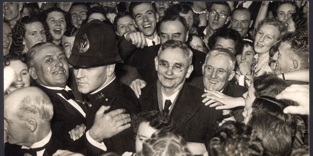 Labour leader Michael Joseph Savage (centre) - being greeted by crowds in 1938 - was a revolutionary figure in New Zealand politics.