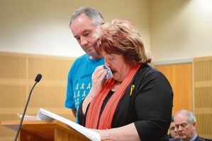 Anna Osborne reads out her victim impact statement, supported by friend Tom Daly. Photo / Greymouth Star