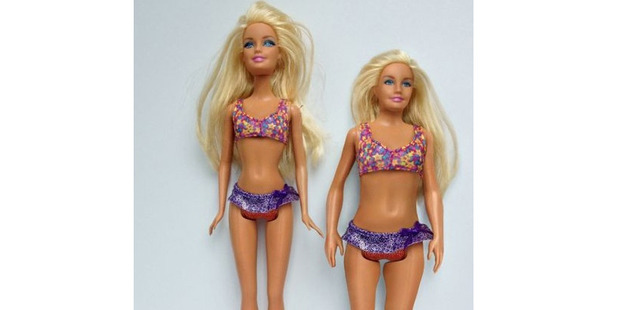 Using the measurements of an average 19-year-old woman, artist Nickolay Lamm has created a Barbie shaped like a real person (right).