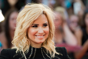Demi Lovato poses on the red carpet during the 2013 MuchMusic Video Awards in Toronto. Photo/AP