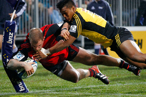 Owen Franks of The Cruaders is tackled by Julian Savea of the Hurricanes during the round 20 Super Rugby match between the Crusaders and the Hurricanes. Photo / Getty Images.