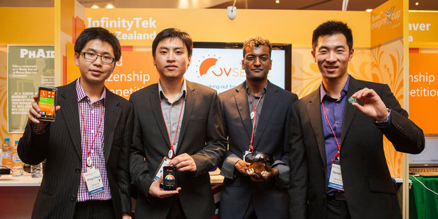 InfinityTek team members Ming Cheuk, Jacky Zhen, Muthu Chidambaram and Daniel Xu showcasing their sunsmart app at the Imagine Cup in Russia.