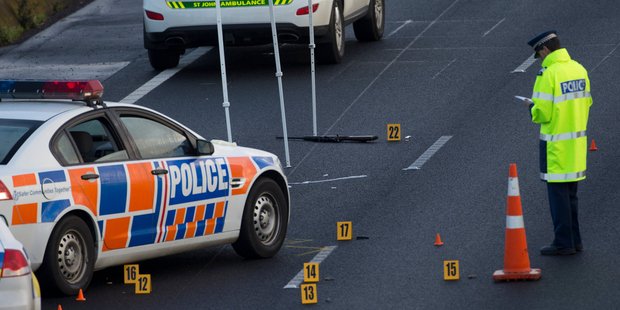 Police investigate the scene where a man was shot on the Northern Motorway near Constellation Drive. Photo / Greg Bowker