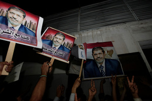 Yemeni protesters hold posters of Egypt's ousted President Mohammed Morsi. Photo / AP
