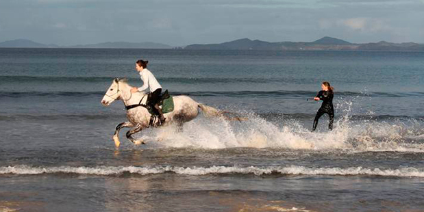 Chloe Phillips-Harris rides Fern and tows wakeboarder Nikita Osbourne. Photo / Julie Harrison