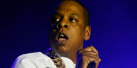 Jay Z says he and Kanye West fought for four days over two songs that appeared on the rapper's new album. Photo / AP