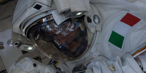 European Space Agency astronaut Luca Parmitano works on the International Space Station before a helmet leak caused concern. Photo / AP