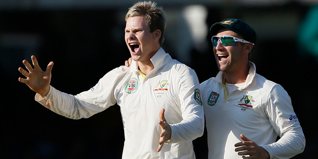 Australia's Steven Smith, left, celebrates the wicket of England's Matt Prior during the Ashes test at Lord's cricket ground in London. Photo / AP
