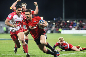 Dan Carter scores a try with team mate Wyatt Crockett celebrating behind, Ben Tapuai of the Reds and during the Super Rugby match between the Crusaders and the Reds. Photo / Getty Images.