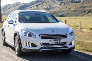 Peugeot's 508 RXH sportswagon is powered by a hybrid diesel engine and has stunning 'claw' front LED lights