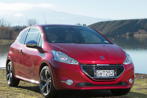 The old 205 GTi (far left) and the Peugeot GTi that has just been launched in NZ.