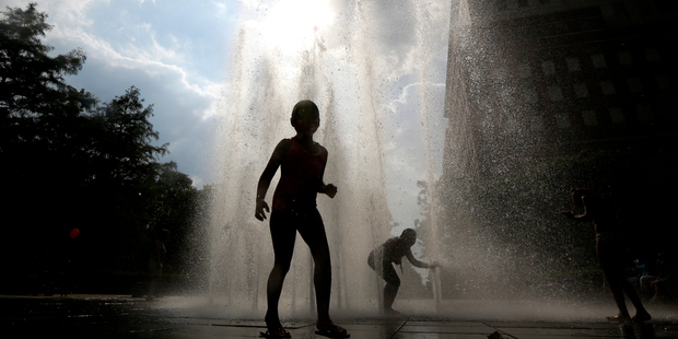 Police and fire chiefs yesterday reiterated warnings about escaping the heat by swimming in open water after four people died in separate incidents on Tuesday. Photo / AP