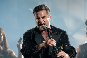 Singer Robbie Williams performs with his band in Gelsenkirchen, Germany. Photo / AP