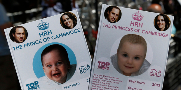 Cards depicting the 'royal baby' either as a boy or a girl, specially made by a games company as a publicity stunt outside the hospital where media are waiting for Kate to give birth. Photo / AP