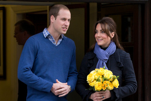 Prince William stands next to his wife Kate, Duchess of Cambridge. Photo / AP