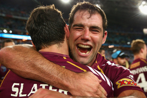 Maroons captain Cameron Smith celebrates with team mate Billy Slater after winning game three of the series between the New South Wales Blues and the Queensland Maroons. Photo / Getty Images.