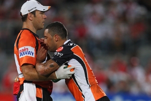 A groggy Benji Marshall (left) receives attention from the trainer. Photo / Getty Images