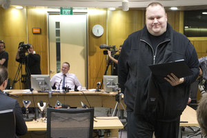 John Key and Kim Dotcom are at odds about whether spying on Dotcom by the GCSB would be lawful or not under proposed changes to the law. Photo / Mark Mitchell