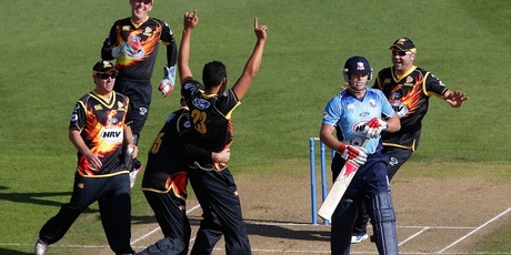 Malaesaili Tugaga is congratulated after taking the wicket of Lou Vincent in the first ball of the Auckland innings. Photo / Getty Images
