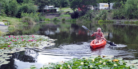 Alan Mitchell tries out the kayak at the Hawkes Bay Naturist club. Photo / Paul Taylor