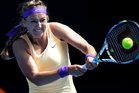 Victoria Azarenka of Belarus hits a return to Jamie Hampton of the US during their third round match at the Australian Open tennis championship in Melbourne. Photo / AP