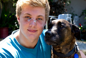 Jacko Gill with Recka, the family pet that bit him. He says it was his fault. 'She is a really lovely dog.' Photo / Dean Purcell