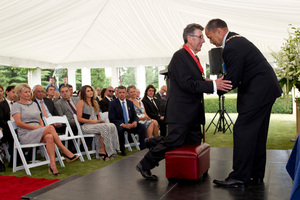 Sir Jerry Mateparae invests Sir Paul Holmes as a Knight Companion of the NZ Order of Merit at a special ceremony. Photo / Richard Robinson