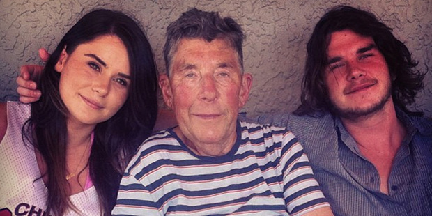 Sir Paul Holmes flanked by daughter Millie and son Reuben, who is back from overseas. Photo / Instagram