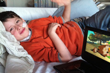 Alijah Williams, 7, still has spasms and faces 12 months of rehabilitation including learning to eat and walk again. 