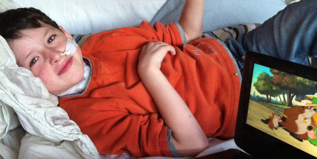 Alijah Williams, 7, still has spasms and faces 12 months of rehabilitation including learning to eat and walk again.