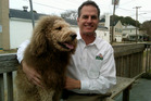 Labradoodle Charles the Monarch pictured here with Virginia Zoo director Greg Brockheim. Photo / AP Labradoodle Charles the Monarch pictured here with Virginia Zoo director Greg Brockheim. Photo / AP