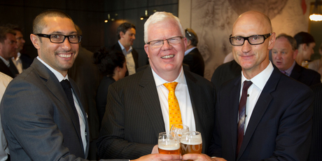 Moa Beers marketing manager Sunil Unka (left) and chief executive Geoff Ross (right) enjoy a toast with NZX chief executive Tim Bennett after listing. Photo / Greg Bowker
