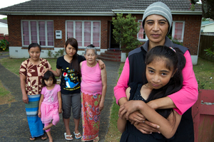 The Shwe family (left) with their neighbour Cheryl Manukau and her daughter. Photo / Brett Phibbs