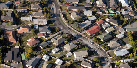 Aerial view of liquefaction and earthquake damaged houses in Burwood, Christchurch. Photo / Geoff Sloan