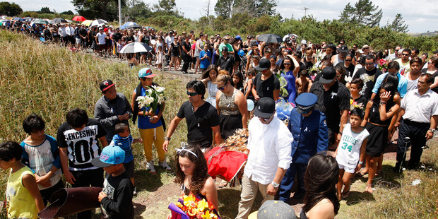 Hundreds attended the tangi of Patricia McGrath and wore white ribbons aymbolising a campaign against violence towards women. Photo / Michael Cunningham