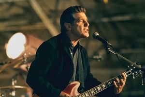 Glenn Frey in action and with the Eagles in their early days. Photo / Supplied