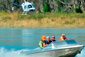 Helicopter and jet-boat-borne search parties head out on the Clutha River yesterday looking for missing South Otago kneeboarder Blake Sinclair. Photo / Gerard O'Brien