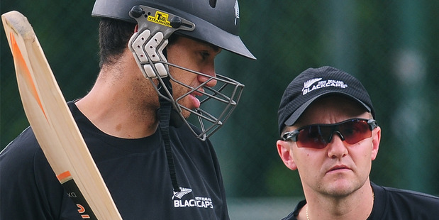 Ross Taylor and coach Mike Hesson chat during a training session in Pallekele last year. Photo / AFP