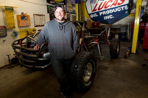 Trevor Cooper with his off-road buggy, one of the many vehicles he has bought since his big win. Photo / Kellie Blizard