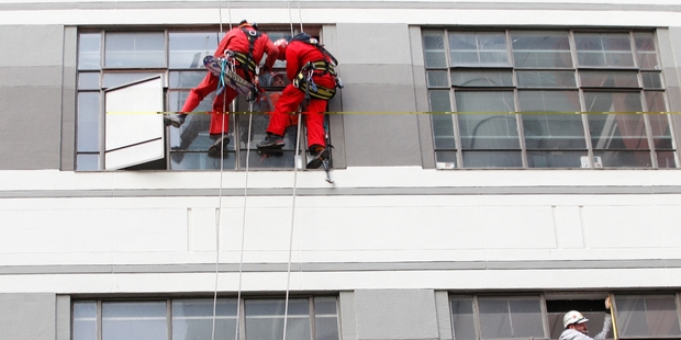 Repairs get under way in Wellington yesterday after Sunday's tremors. Building Act changes could require some properties to be seismically assessed within five years and upgraded within 10. Photo / Mark Mitchell