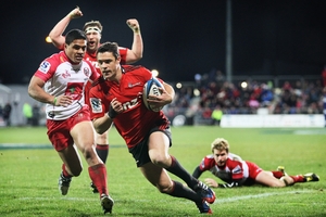 Dan Carter of the Crusaders goes over for his try. The playmaker's form has allowed his backs to cut loose. Photo / Getty Images