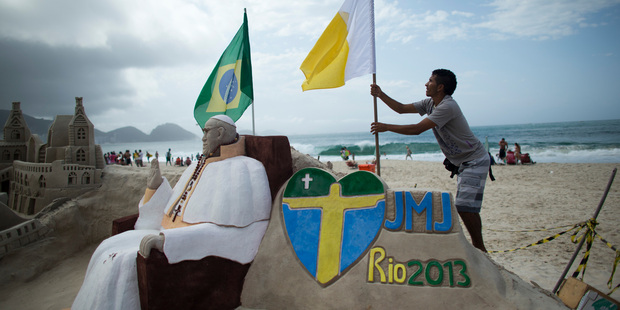 A street artist prepares for the pope's arrival in Rio de Janeiro, Brazil. Photo / AP