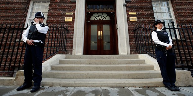 British police officers guard the entrance of St. Mary's Hospital exclusive Lindo Wing in London.Photo / AP
