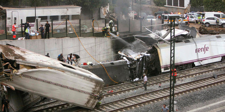 Emergency personnel respond to the scene of a train derailment in Santiago de Compostela, Spain. Photo / AP