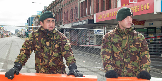 Privates Te Mana Ekoi, (l)and Leon Griffiths man a cordon in Christchurch after the earthquakes. What happens when a tenant can't physically get to their business? Photo / NZPA