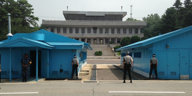South Korean soldiers eyeball their adversaries across the border. Photo / NZ Herald