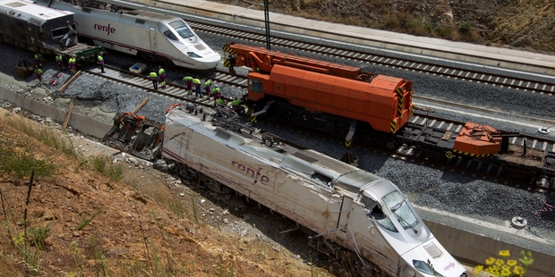 The eight-carriage train was hurtling round a bend at 179 kilometres per hour when it tore off the rails. Photo / AP