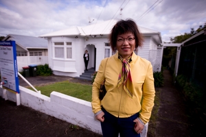 Home buyer Hongying Qiu checks out a house in Grey Lynn yesterday, before it goes to auction. Photo / Dean Purcell