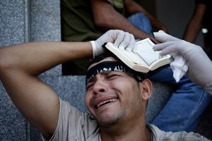 An Egyptian grieves after dozens of supporters of ousted President Mohamed Morsi were killed. Photo / AP