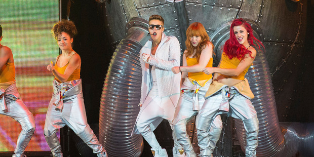 Justin Bieber, center, performs in a concert at the Wells Fargo Center in Philadelphia. Photo / AP